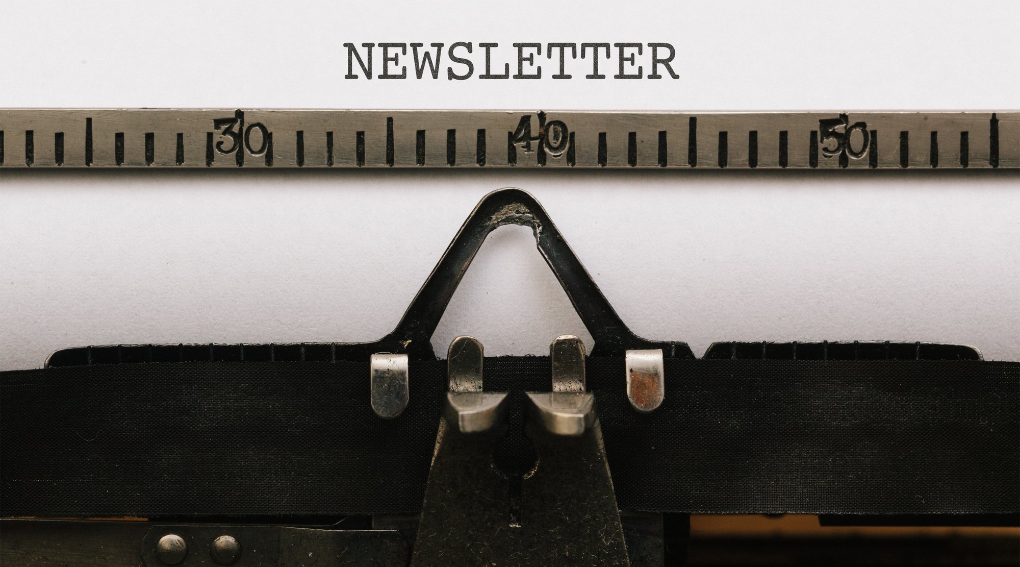 paper-with-newsletter-text-in-old-typewriter-2024-09-12-08-08-32-utc